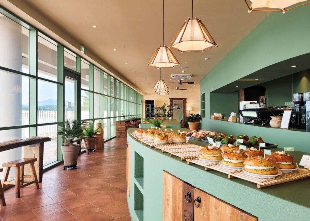 sage green interior of seogwipean bakery and bagels, pastries, croissants and bread