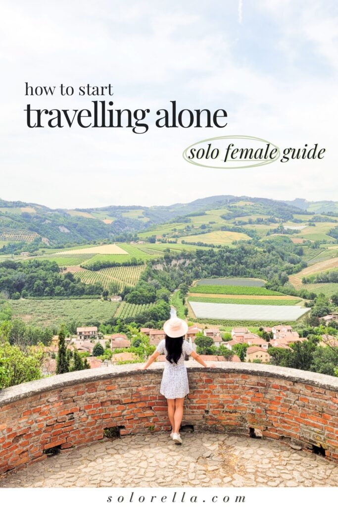female traveller alone looking at Italian countryside